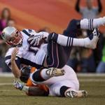New England Patriots quarterback Tom Brady was sacked by the Denver Broncos’ Terrance Knighton during third quarter action in the AFC Championship Game at Mile High Stadium in Denver.